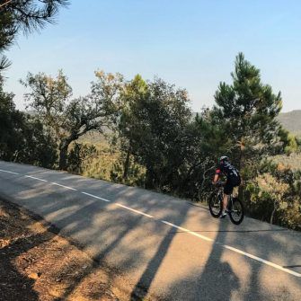 Cyclist on the els àngels climb near Girona