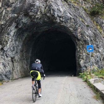 Laghi Cancano tunnel with cyclist