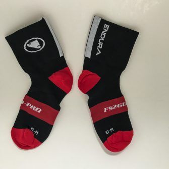 Two endura FD260 red and black socks, showing different logos on cuffs