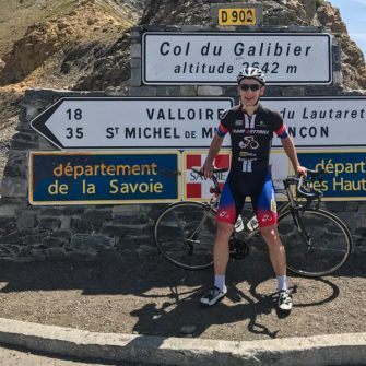 Cyclist at top of Col du Galibier