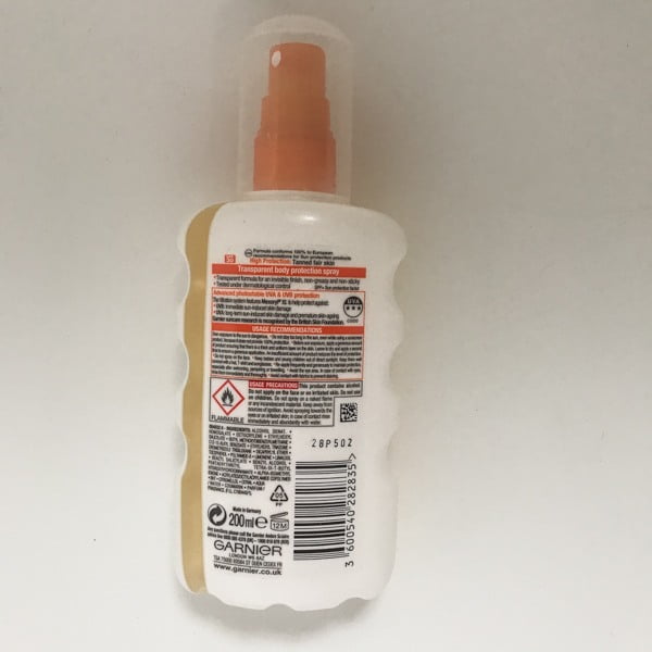 Back view of ambre solaire sunscreen bottle