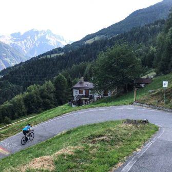 Cyclist on switchback on Passo Mortirolo