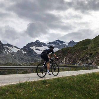 Cyclist near the summit of Passo del Bernina