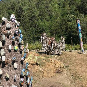 Art garden and totem poles on Stelvio Pass climb from Prato dello Stelvio