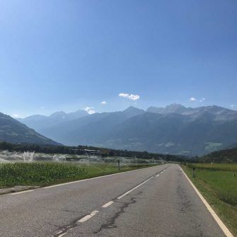Long sunny cycling roads in Italy near Stelvio Pass climb