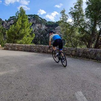 Cyclist riding up the switchbacks from Port de Valldemossa, Mallorca