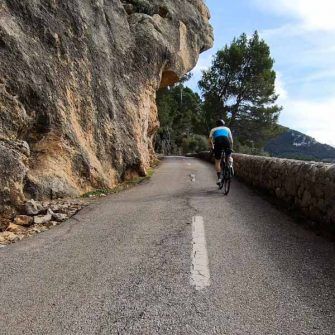Cyclist on very narrow road from Puerto Valldemossa Mallorca
