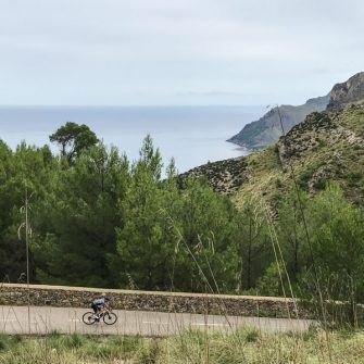 Cyclist cycling in Mallorca near Betlem Monastery