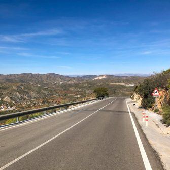 Cycling Andalucia Almeria copyright Epic Road Rides-28 Long road with blue sky and hills behind