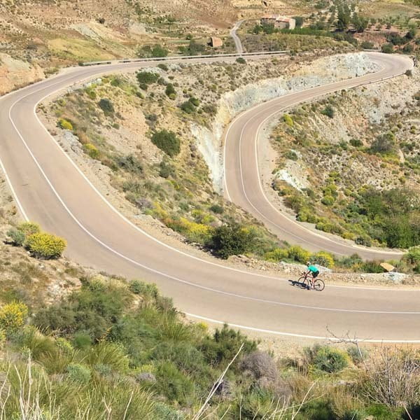 Cyclist on looping road in Almeria