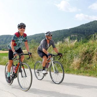 Cyclists on Girona's cycling climbs