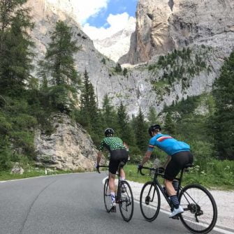 Cyclists cycling Passo Sella, Dolomites